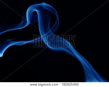 Blue cloudy smoke on black background.  abstract