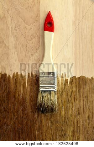 White brush on wooden background. hardwood tool