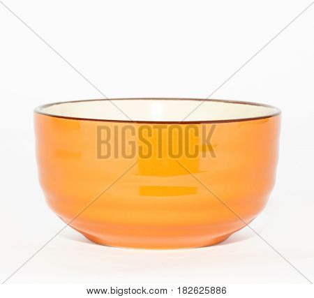 orange ceramic bowl isolated on white background