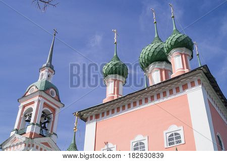 Domes of Beautiful Russian Pink Christian Church in Kostroma blue sky