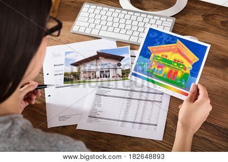 Close-up Of A Person Analyzing The Heat Loss And Energy Efficiency Of A House