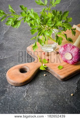 Fresh Parsley And Garlic On Cutting Board