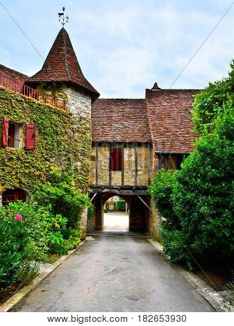 Picturesque Archway Over A Street In The Beautiful Village Of Autoire, France