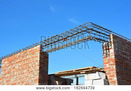 Lintel Construction. Rebar steel bars on new home construction corner reinforcement concrete bars with wire rod as a lintel for window. Brickwork with Iron Bars