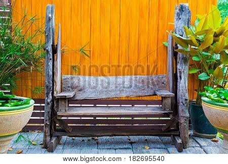 old rastic wooden chairs in the garden