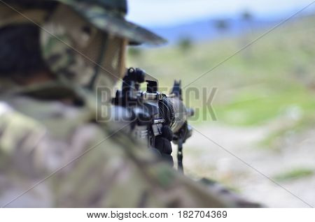 Special forces soldier aim target with sub machine gun