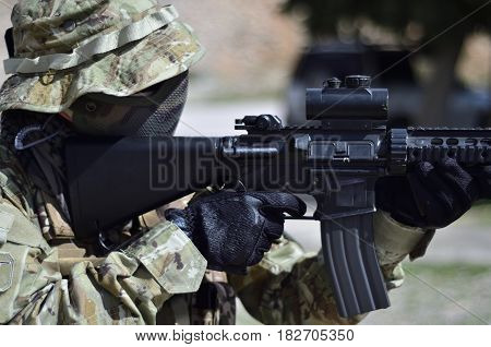 Special forces soldier aim target with sub machine gun