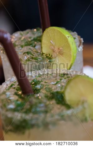 Thai Cocktail with lemon, brown sugar an mince leafs
