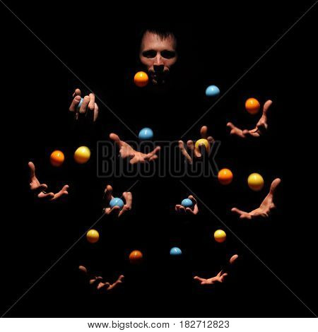 Talented man juggling with color balls. Successful concept. Caucasian performer show exhibition.