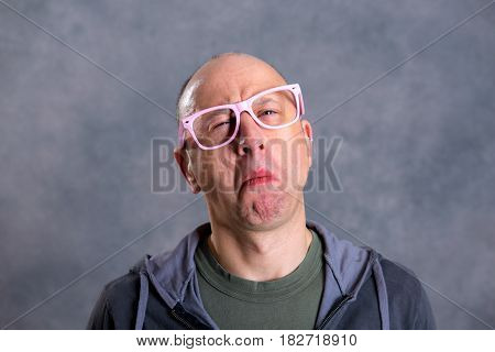 Funny Baldheaded Man With Pink Glasses