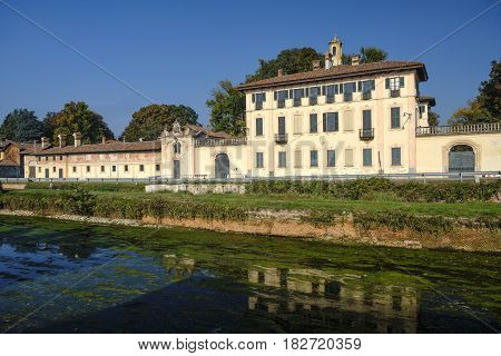 Cassinetta di Lugagnano (Milan Lombardy Italy): facade of the historic Villa Visconti Maineri along the canal known as Naviglio Grande of Turbigo