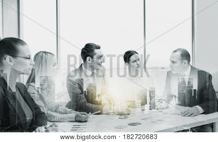 business, teamwork and people concept - team at office meeting over city buildings and double exposure effect