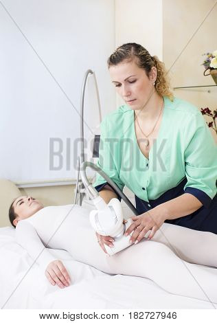 Woman is in the process at the clinic lipomassage