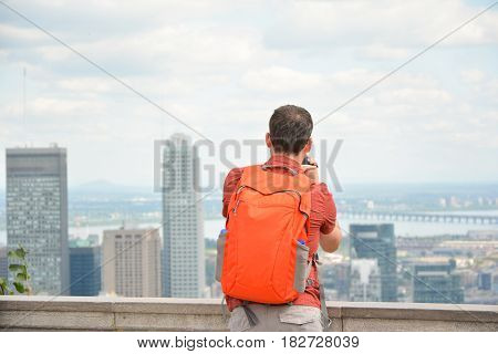 man looking at Montreal downtown skyline cityscape. Canada.