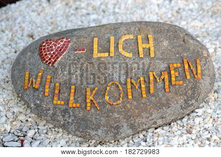 Mosaic stone shows 'welcome' as a greeting