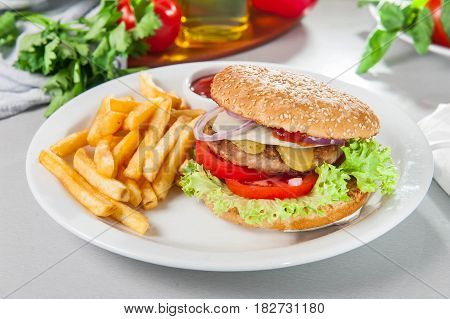 Tasty Burger Set - Meat Burger, French Fries And Sause On The White Round Plate On The Served Table