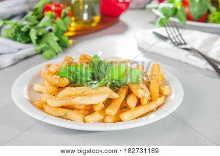 A Serving Plate Of French Fries On The Served Table With Fresh Ingridients. Close- Up. Selective Foc