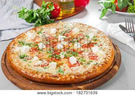 Four Cheese Pizza Quattro Fromaggi On A Rustic Wooden Board On The Table With Ingridients. Selective