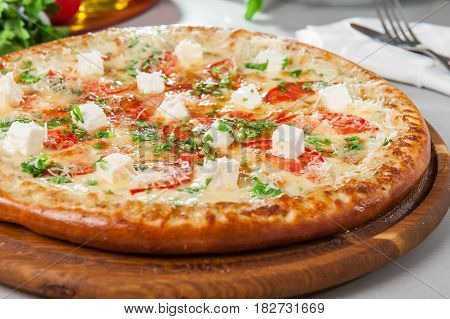 Four Cheese Pizza Quattro Fromaggi On A Rustic Wooden Board On The Table With Ingridients. Selective