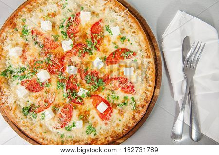 Top View Four Cheese Pizza Quattro Fromaggi On A Rustic Wooden Board On The Table With Ingridients.