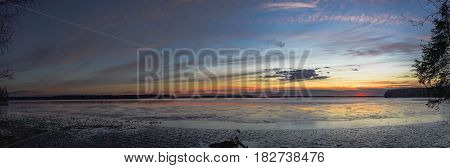 Sunset scene on the frozen lake at sunset