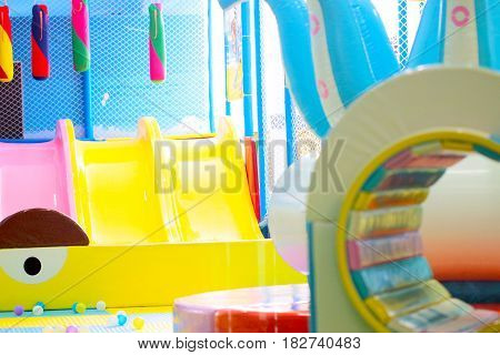 Entertaining carousels and plastic slides on the children playground