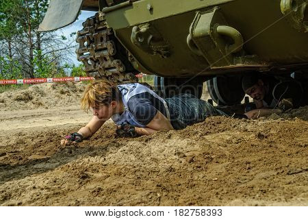 Girl Moves Under Tank In Extrim Race. Tyumen