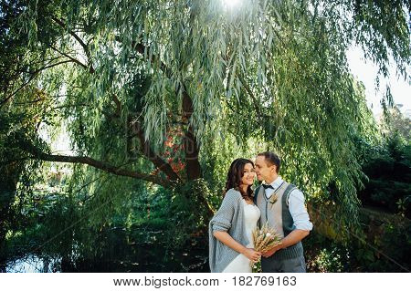 Happy Couple Walking In Summer Park