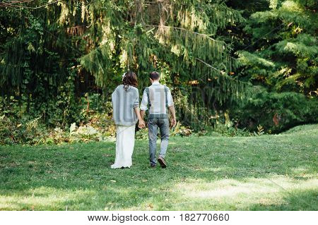 Happy Couple Walking In Summer Park
