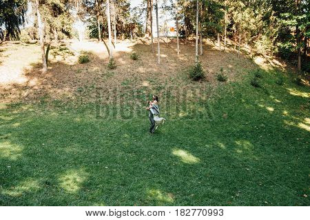 Happy Couple Walking In Summer Park