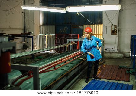 Beautiful Woman In Red Safety Helmet Work As Industrial Worker