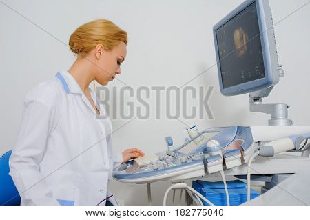 Doctor Analyze The Result Of Ultrasound Diagnostic Machine