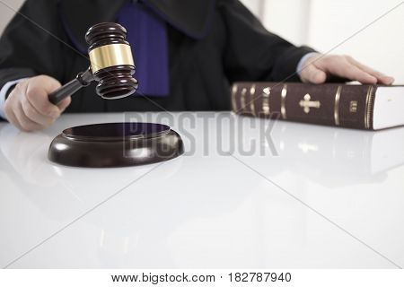 Mallet in the hand of the judge. Law concept.