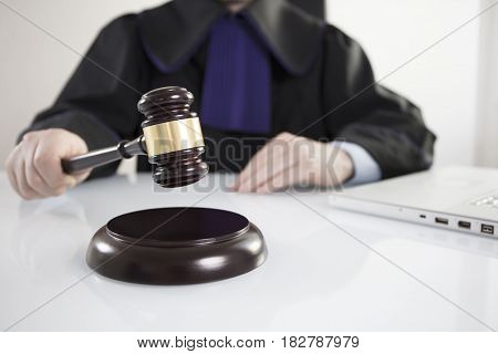 Mallet in the hand of the judge. Law concept.