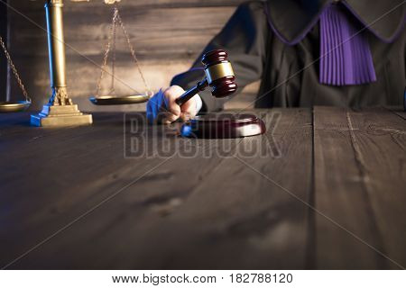 Mallet in the hand of the judge. Law concept.