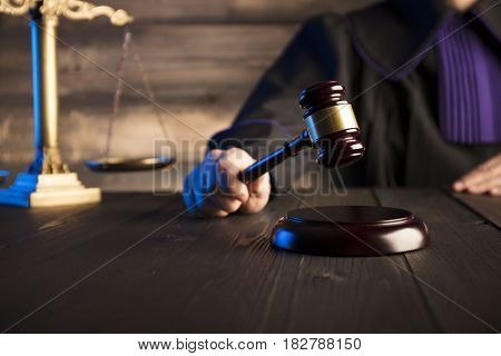 Mallet in the hand of the judge. Law concept.