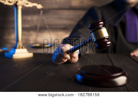 Mallet in the hand of the judge. Law concept.