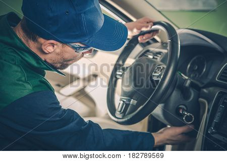 Car Recall Maintenance. Automotive Recall Concept. Technician Preparing Vehicle For the Repair.