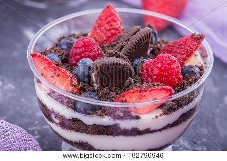 A cookies dessert and cream of mascarpone with fresh berries