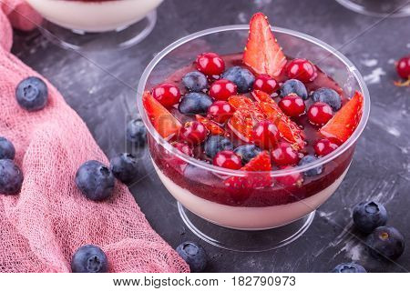 Milk jelly with home-made jam and fresh berries