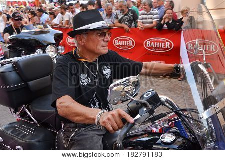 LE MANS FRANCE - JUNE 13 2014:Parade of pilots racing.Old men on motorcycle in Le Mans France.