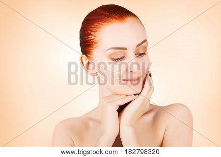 gorgeous brown eyed red haired model portrait with skin surgery mark isolated