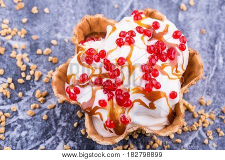 Caramel ice cream in a basket with jelly balls