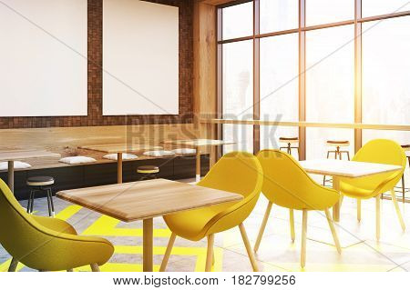 Side view of a afe interior with a geometric floor pattern bright yellow chairs and three vertical posters hanging on a wall. 3d rendering mock up toned image
