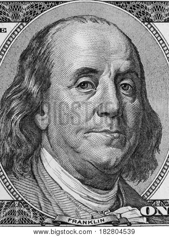 Closeup of Benjamin Franklin on hundred dollar American banknote