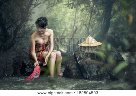 Asian sexy woman washing in streams, Thailand Countryside