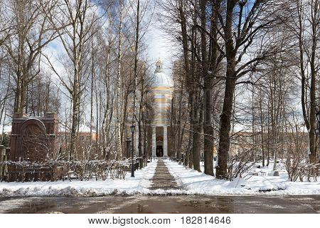 Alley to the Trinity Cathedral in April afternoon. The Alexander Nevsky Lavra. St. Petersburg. Russia