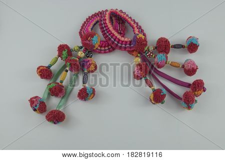 Colorful Tassel And Hmong hilltribe Handmade with selective and soft focus.