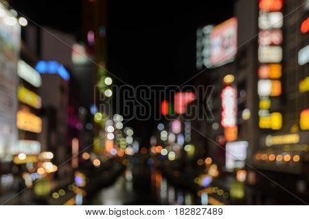 Abstract blur Illuminated billboards of store and restaurant at night in Osaka, Japan