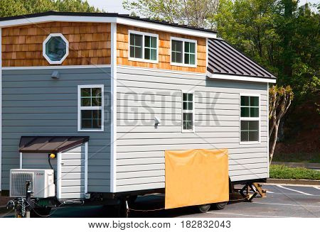 Tiny house for sale on a lot.